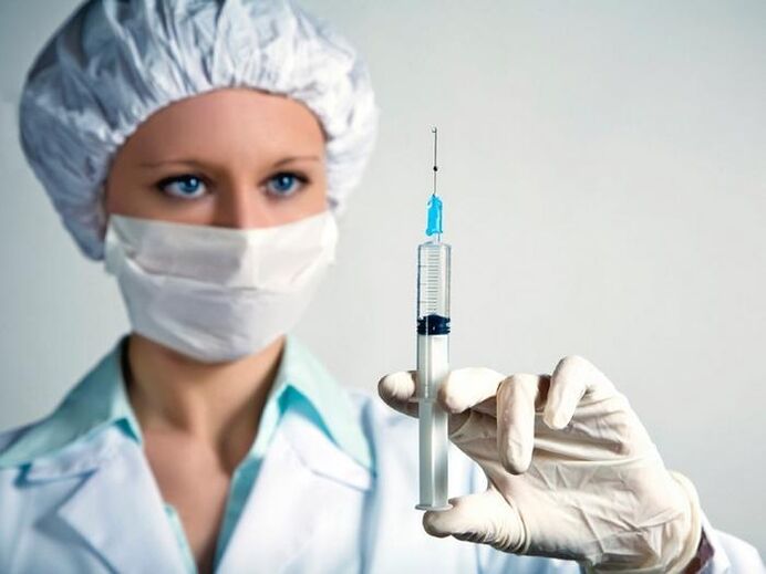 syringe with vaccine and alcohol consumption